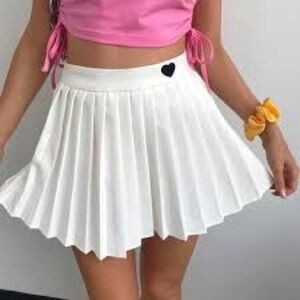 White tennis skirt with black heart.